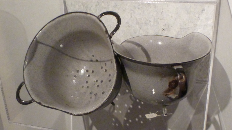 Strainer and chamber pot fashioned from German helmets after the end of the Second World War. Resistance Museum, Amsterdam, September 8, 2013.